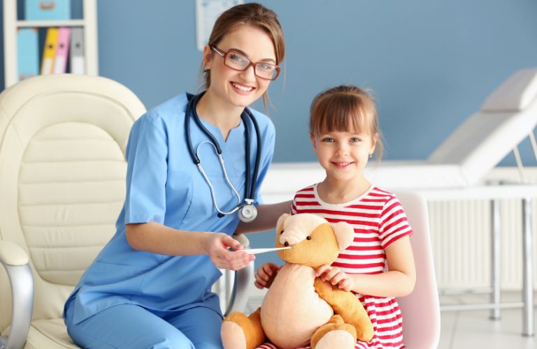 nurse posing with a child